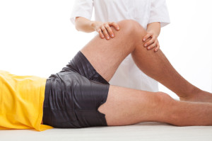 Physiotherapist massaging a leg